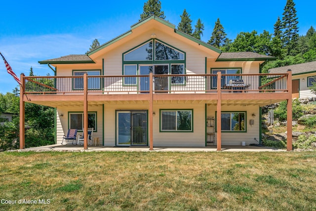 17544 E Arapaho Rd, Bayview, ID 83803 - rear view of house with a patio, a lawn, and a deck