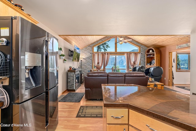 17544 E Arapaho Rd, Bayview, ID 83803 - kitchen with stainless steel fridge, wooden ceiling, dark countertops, light wood-style flooring, and lofted ceiling