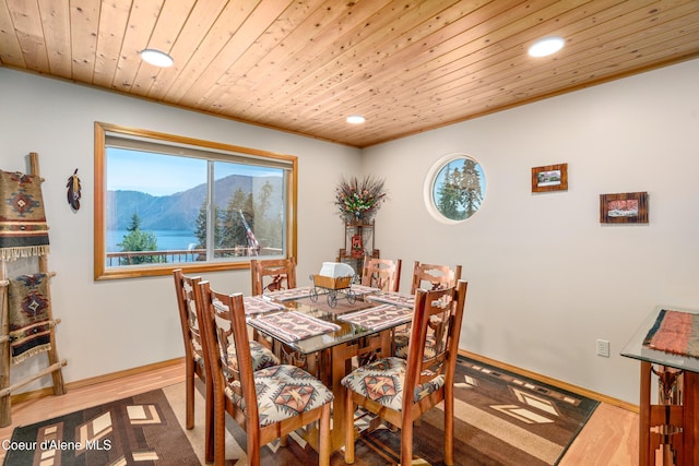 17544 E Arapaho Rd, Bayview, ID 83803 - dining space featuring recessed lighting, healthy amount of natural light, a mountain view, wooden ceiling, and crown molding