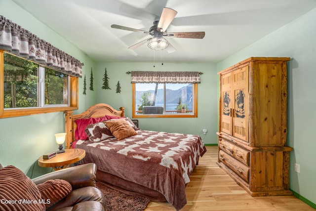 17544 E Arapaho Rd, Bayview, ID 83803 - bedroom with light wood-type flooring and ceiling fan