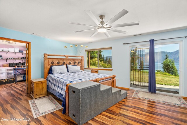17544 E Arapaho Rd, Bayview, ID 83803 - bedroom featuring wood finished floors, access to exterior, and a ceiling fan
