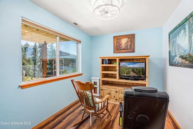 17544 E Arapaho Rd, Bayview, ID 83803 - office space with wood finished floors and a chandelier