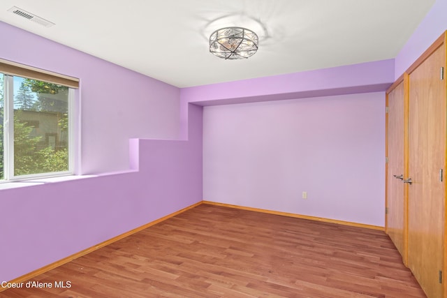17544 E Arapaho Rd, Bayview, ID 83803 - unfurnished bedroom with light wood-type flooring and a closet
