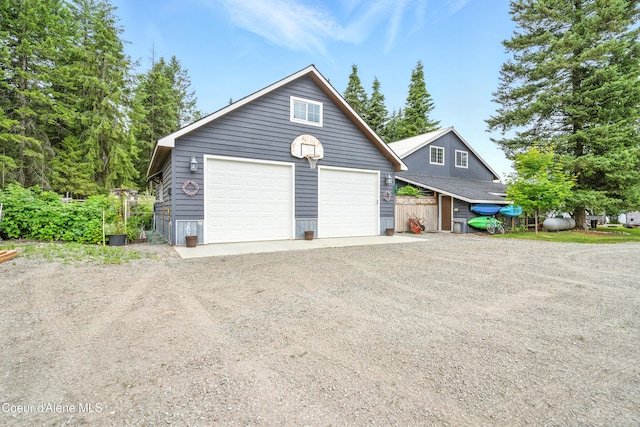 80 Half Cir, Priest River, ID 83856 - view of front facade featuring a garage and an outdoor structure