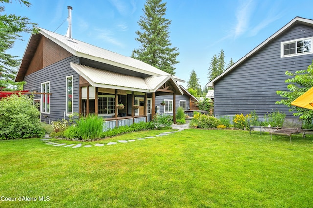 80 Half Cir, Priest River, ID 83856 - back of property featuring a lawn and a metal roof