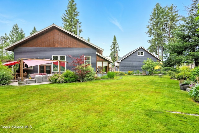 80 Half Cir, Priest River, ID 83856 - rear view of property with outdoor lounge area, a yard, and a patio