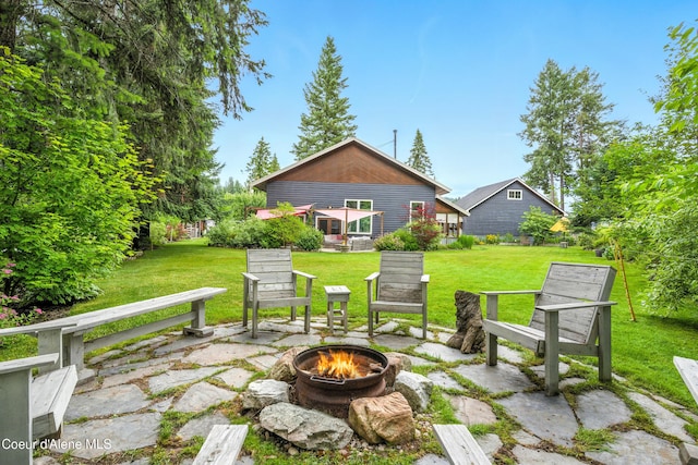 80 Half Cir, Priest River, ID 83856 - view of patio / terrace with an outdoor fire pit