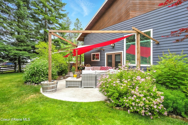 80 Half Cir, Priest River, ID 83856 - back of house with outdoor lounge area, a lawn, a patio area, and french doors