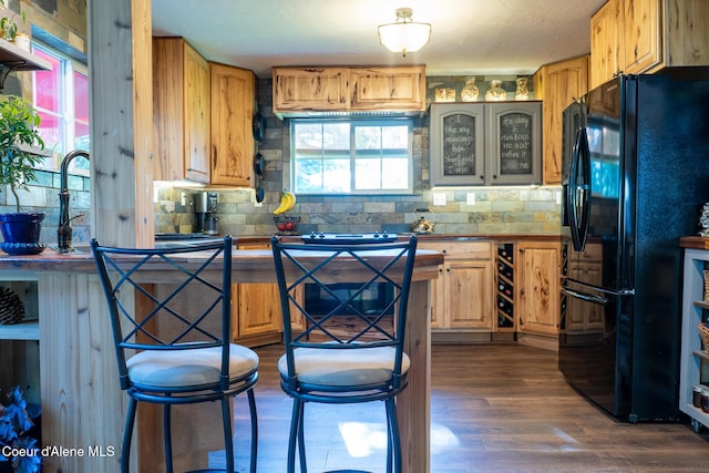 80 Half Cir, Priest River, ID 83856 - kitchen featuring freestanding refrigerator, backsplash, dark wood-type flooring, and glass insert cabinets
