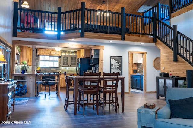 80 Half Cir, Priest River, ID 83856 - dining area featuring a high ceiling, dark wood finished floors, recessed lighting, and stairway
