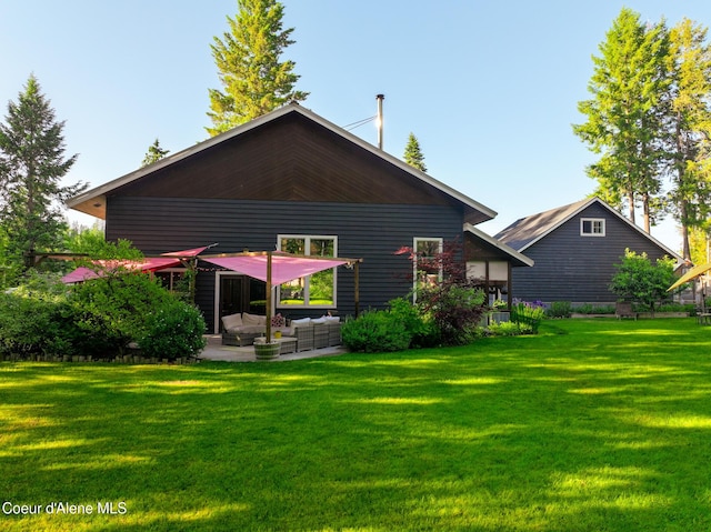 80 Half Cir, Priest River, ID 83856 - back of property featuring an outdoor living space, a yard, and a patio area