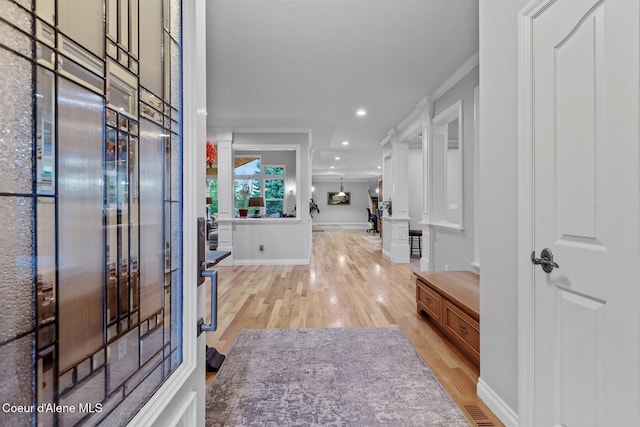 12155 N Yearling Cir, Hayden, ID 83835 - foyer featuring light wood finished floors, ornamental molding, and recessed lighting