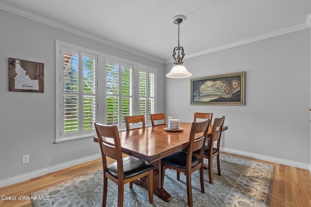 12155 N Yearling Cir, Hayden, ID 83835 - dining room featuring crown molding, wood finished floors, and a textured ceiling