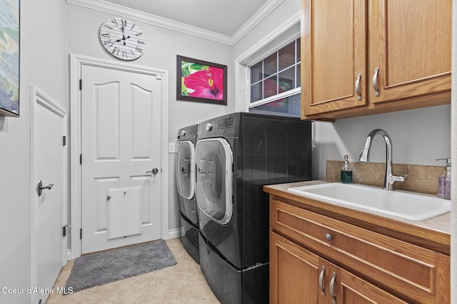 12155 N Yearling Cir, Hayden, ID 83835 - laundry area featuring independent washer and dryer, cabinet space, crown molding, and light tile patterned floors