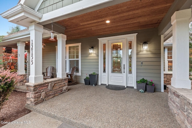 12155 N Yearling Cir, Hayden, ID 83835 - doorway to property featuring a porch