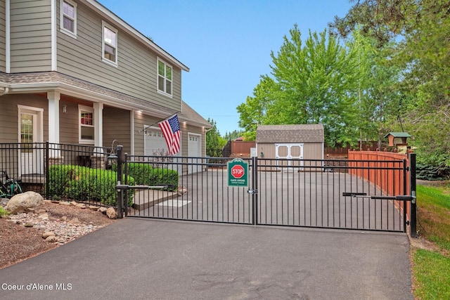 12155 N Yearling Cir, Hayden, ID 83835 - gate with a storage shed