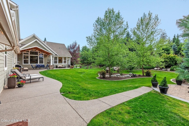 12155 N Yearling Cir, Hayden, ID 83835 - view of grassy yard featuring a patio