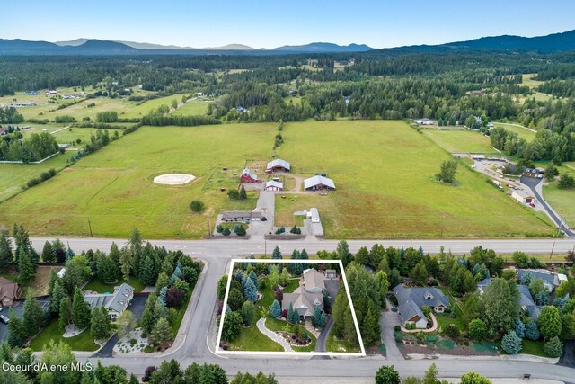 12155 N Yearling Cir, Hayden, ID 83835 - aerial view of property and surrounding area featuring property boundaries highlighted and a mountain backdrop