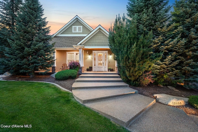 12155 N Yearling Cir, Hayden, ID 83835 - view of front of property with a lawn and a shingled roof