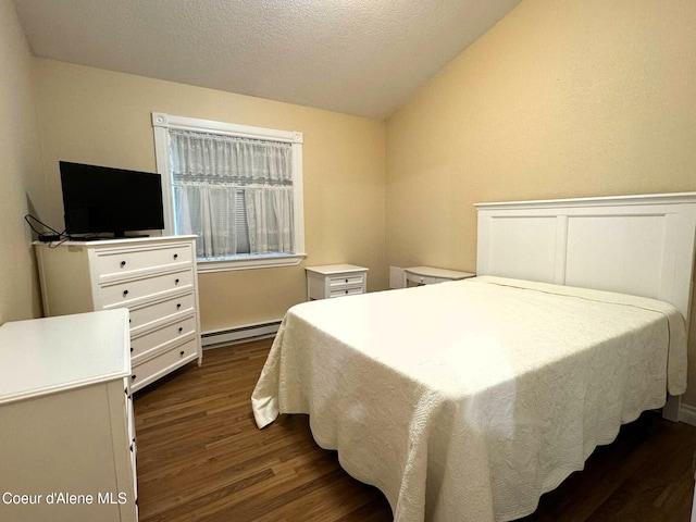 623 E Whispering Pines Ln # 3, Coeur Dalene, ID 83815 - bedroom featuring a baseboard heating unit, dark wood-style flooring, vaulted ceiling, and a textured ceiling