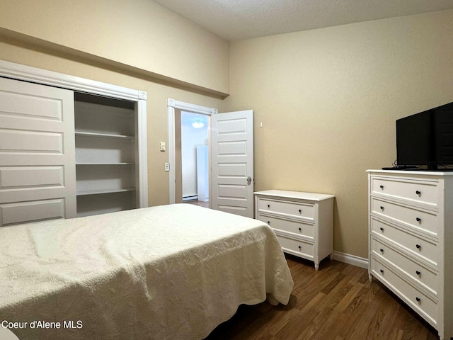 623 E Whispering Pines Ln # 3, Coeur Dalene, ID 83815 - bedroom featuring dark wood-style flooring