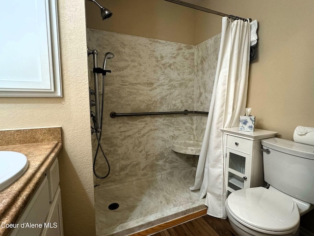 623 E Whispering Pines Ln # 3, Coeur Dalene, ID 83815 - bathroom featuring a shower with shower curtain, vanity, and wood finished floors