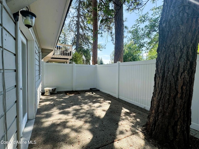 623 E Whispering Pines Ln # 3, Coeur Dalene, ID 83815 - fenced backyard with a patio area