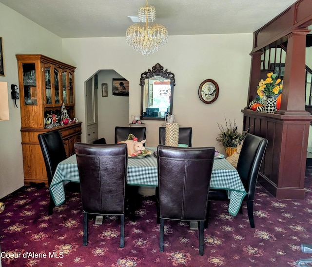 6702 Kelso Lake Rd, Athol, ID 83801 - dining space with carpet floors and a chandelier