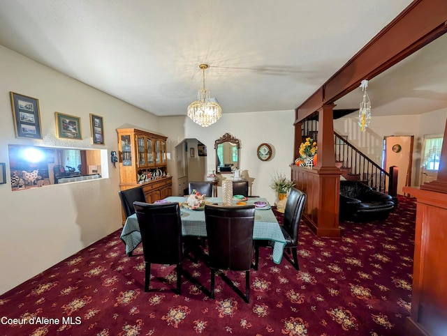 6702 Kelso Lake Rd, Athol, ID 83801 - carpeted dining space featuring a chandelier and stairs