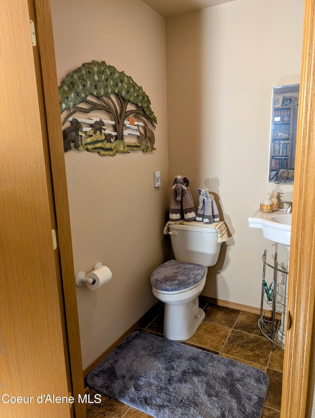 6702 Kelso Lake Rd, Athol, ID 83801 - bathroom featuring toilet and baseboards