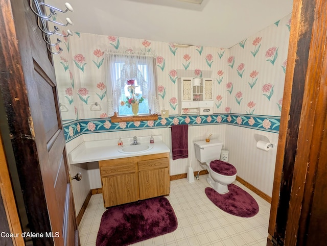 6702 Kelso Lake Rd, Athol, ID 83801 - half bathroom with wallpapered walls and vanity