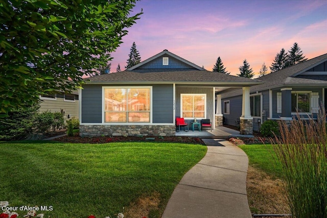 1232 W Grove Way, Coeur Dalene, ID 83815 - view of front of property featuring stone siding, a porch, a yard, and a shingled roof