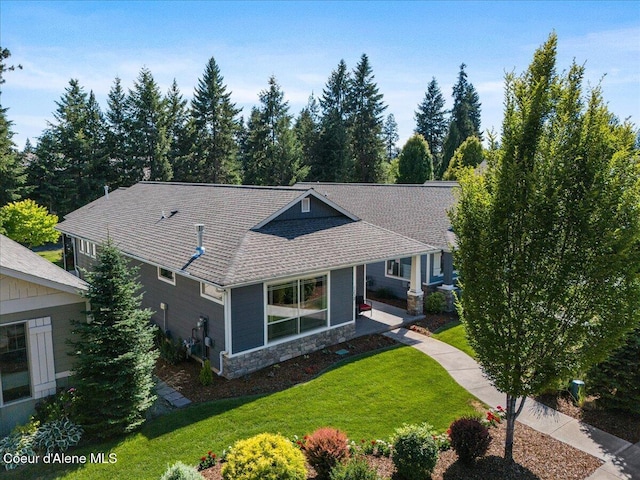 1232 W Grove Way, Coeur Dalene, ID 83815 - view of front facade featuring a front yard, stone siding, and a shingled roof