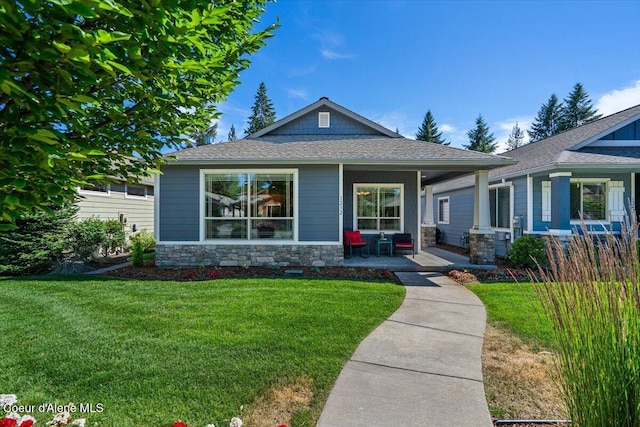 1232 W Grove Way, Coeur Dalene, ID 83815 - view of front facade featuring a front lawn, stone siding, covered porch, and roof with shingles