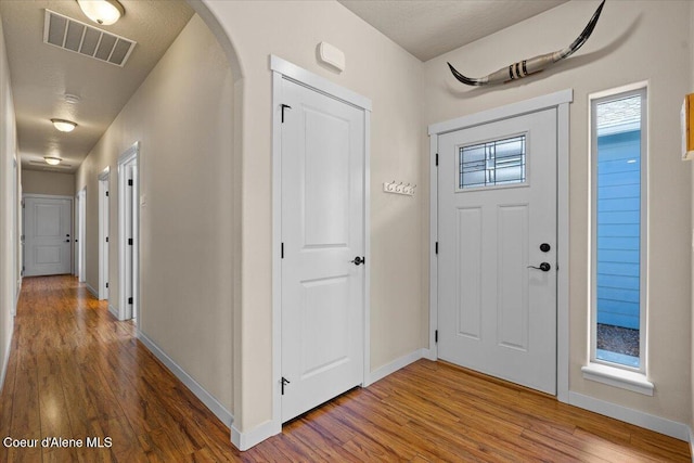 1232 W Grove Way, Coeur Dalene, ID 83815 - foyer entrance featuring wood finished floors and arched walkways