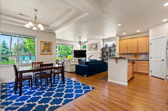 1232 W Grove Way, Coeur Dalene, ID 83815 - dining space with a textured ceiling, light wood finished floors, a chandelier, recessed lighting, and ceiling fan
