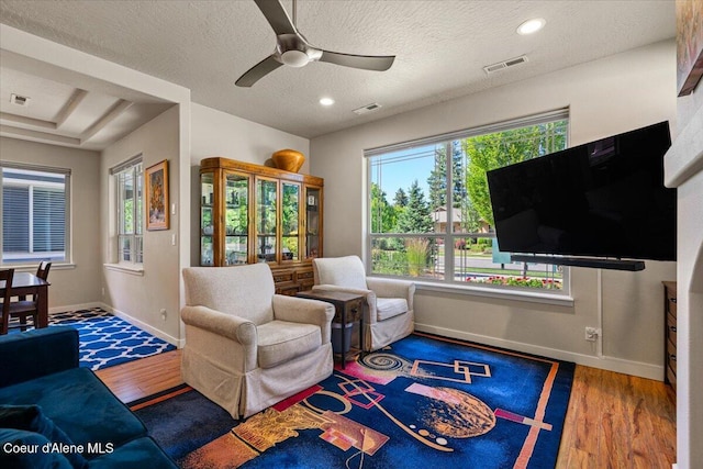 1232 W Grove Way, Coeur Dalene, ID 83815 - living room featuring wood finished floors, ceiling fan, recessed lighting, and a textured ceiling
