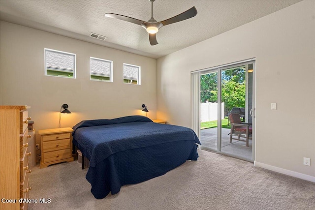 1232 W Grove Way, Coeur Dalene, ID 83815 - carpeted bedroom featuring access to outside, a textured ceiling, and a ceiling fan