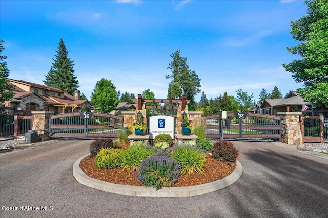1232 W Grove Way, Coeur Dalene, ID 83815 - community / neighborhood sign featuring a gate and a residential view