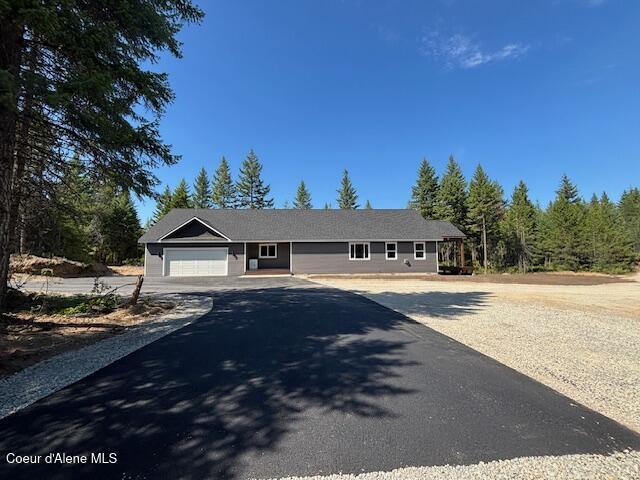 32926 N 10th Ave, Spirit Lake, ID 83869 - single story home featuring an attached garage and asphalt driveway