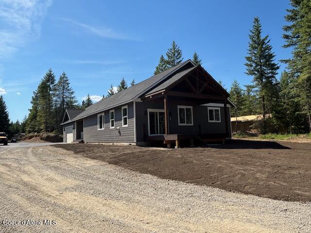 32926 N 10th Ave, Spirit Lake, ID 83869 - view of side of property featuring driveway and an attached garage