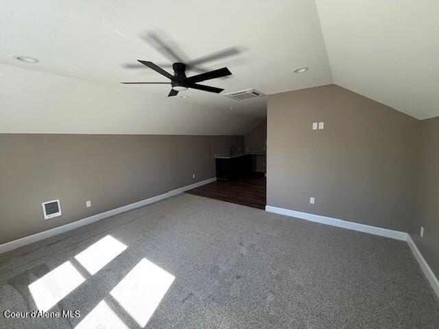 32926 N 10th Ave, Spirit Lake, ID 83869 - additional living space with vaulted ceiling, a ceiling fan, and carpet flooring