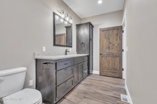 32926 N 10th Ave, Spirit Lake, ID 83869 - bathroom with vanity, wood finished floors, and recessed lighting