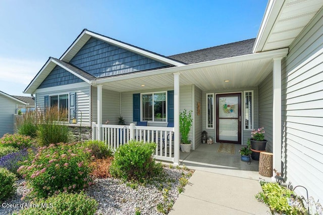6487 W Covenant St, Rathdrum, ID 83858 - doorway to property with a porch and a shingled roof