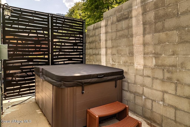 98 Chutes Ln, Sandpoint, ID 83864 - view of patio / terrace featuring a hot tub