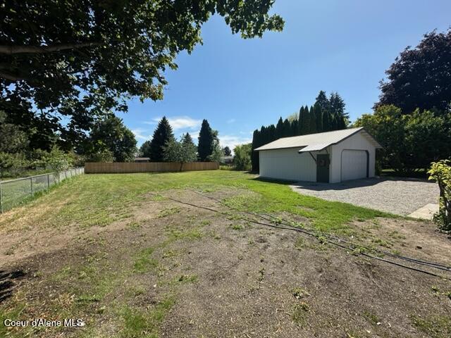 320 E Dakota Ave, Hayden, ID 83835 - view of yard with a detached garage and an outdoor structure