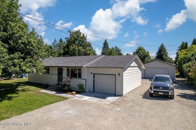 320 E Dakota Ave, Hayden, ID 83835 - single story home with a front lawn, roof with shingles, and a garage