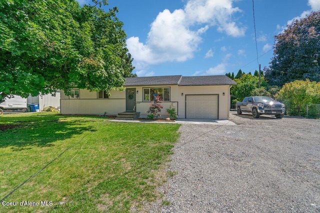 320 E Dakota Ave, Hayden, ID 83835 - ranch-style house featuring an attached garage, driveway, and a front yard
