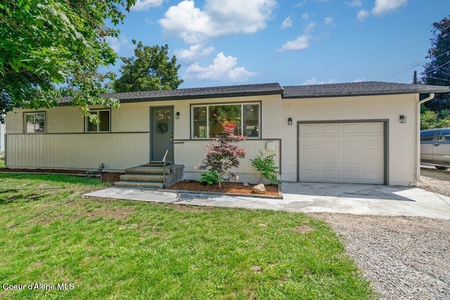 320 E Dakota Ave, Hayden, ID 83835 - ranch-style home with driveway, a garage, and a front lawn