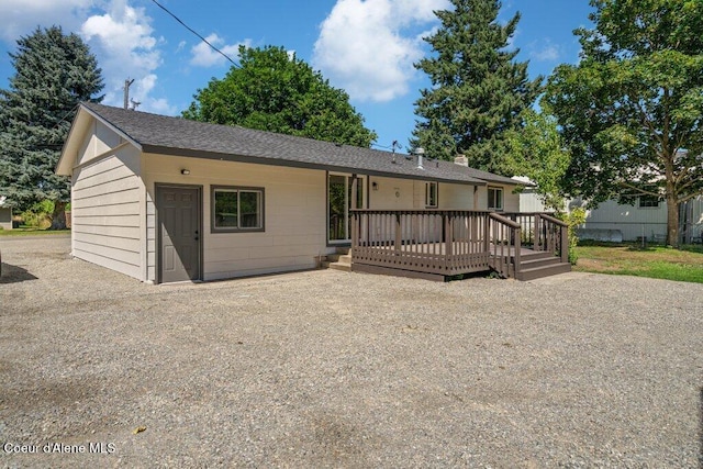 320 E Dakota Ave, Hayden, ID 83835 - view of front facade with a deck and roof with shingles